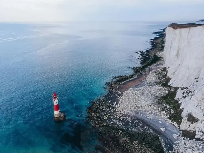 Framed Print : Aerial Drone Landscape photo of a Beachy Head Lighthouse and chalk cliffs at colorful sunrise with low tide in England Framed Print : Aerial Drone Landscape photo of a Beachy Head Lighthouse and chalk cliffs at colorful sunrise with low tide in England