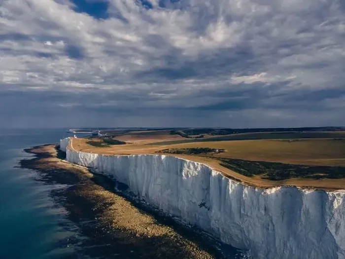 Framed Print : Aerial Drone Landscape photo of a Beachy Head Lighthouse and chalk cliffs at colorful sunrise with low tide in England Framed Print : Aerial Drone Landscape photo of a Beachy Head Lighthouse and chalk cliffs at colorful sunrise with low tide in England