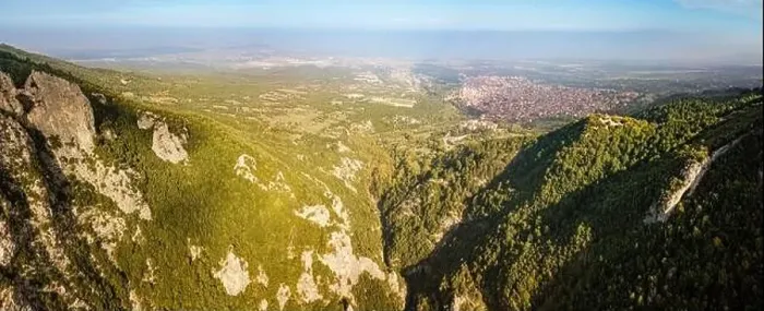 Framed Print : Aerial drone panoramic view of deep gorge and rocky ridge near Mountain Olympus and Litochoro village in the distance Framed Print : Aerial drone panoramic view of deep gorge and rocky ridge near Mountain Olympus and Litochoro village in the distance