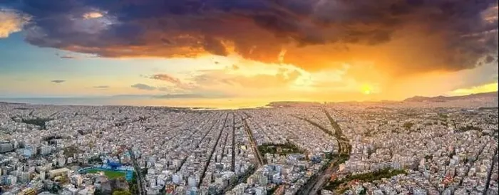 Framed Print : Aerial drone panoramic view of the Greek capital Athens at sunset with a sky overcast with storm clouds Framed Print : Aerial drone panoramic view of the Greek capital Athens at sunset with a sky overcast with storm clouds