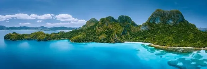 Framed Print : Aerial drone panoramic view of uninhabited tropical island with rugged mountains Framed Print : Aerial drone panoramic view of uninhabited tropical island with rugged mountains