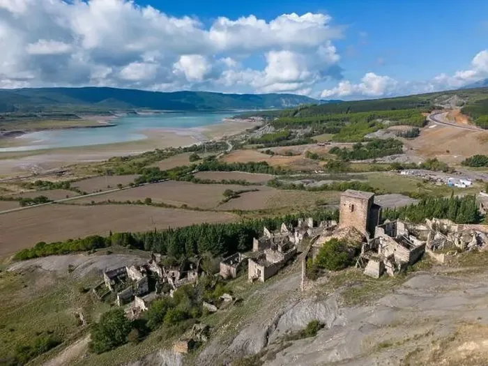 Framed Print : Aerial drone photo of the abandoned ghost town named Esco. Esco is located next to lake Aragon in Northern Spain Framed Print : Aerial drone photo of the abandoned ghost town named Esco. Esco is located next to lake Aragon in Northern Spain