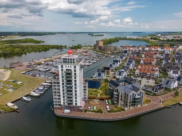 Framed Print : Aerial drone photo of an apartment building that looks like a lighthouse in Harderwijk, the Netherlands Framed Print : Aerial drone photo of an apartment building that looks like a lighthouse in Harderwijk, the Netherlands