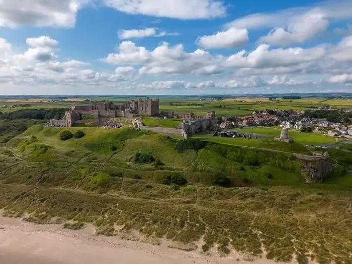 Framed Print : Aerial drone photo of Bamburgh Castle at the beautiful coastline of Northumberland