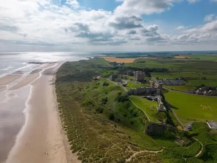 Framed Print : Aerial drone photo of Bamburgh Castle at the beautiful coastline of Northumberland