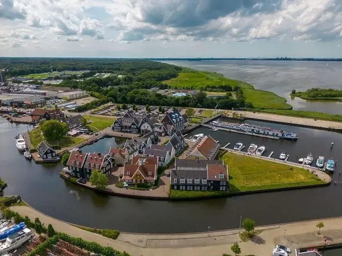 Framed Print : Aerial drone photo of the dutch town Huizen in Utrecht. It has a large marina with typical dutch houses Framed Print : Aerial drone photo of the dutch town Huizen in Utrecht. It has a large marina with typical dutch houses