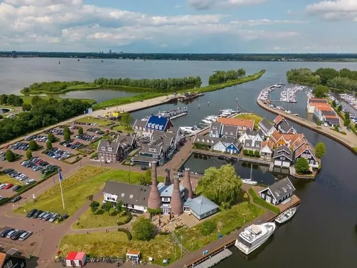 Framed Print : Aerial drone photo of the dutch town Huizen in Utrecht. It has a large marina with typical dutch houses Framed Print : Aerial drone photo of the dutch town Huizen in Utrecht. It has a large marina with typical dutch houses