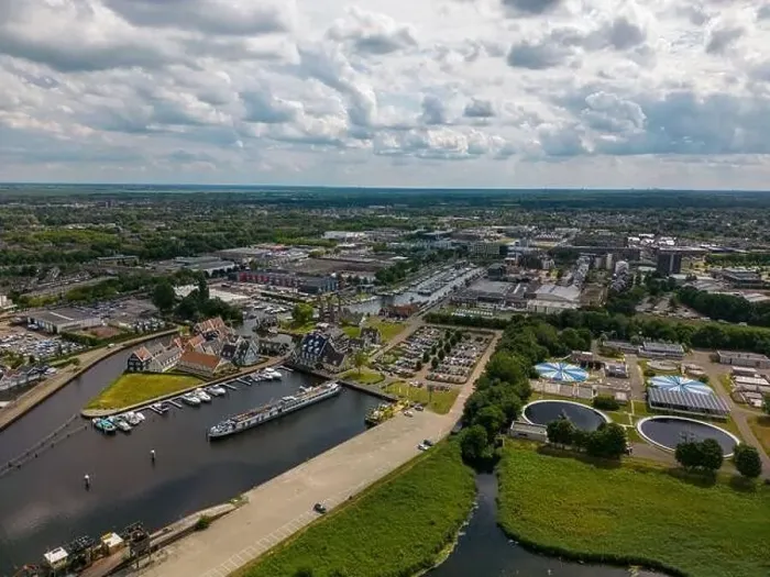 Framed Print : Aerial drone photo of the dutch town Huizen in Utrecht. It has a large marina with typical dutch houses Framed Print : Aerial drone photo of the dutch town Huizen in Utrecht. It has a large marina with typical dutch houses