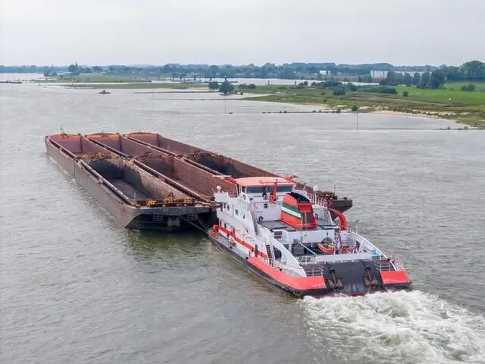Framed Print : Aerial drone photo of a large cargo barge sailing on the river Waal in the Netherlans Framed Print : Aerial drone photo of a large cargo barge sailing on the river Waal in the Netherlans