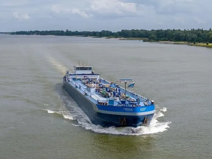 Framed Print : Aerial drone photo of a large cargo barge sailing on the river Waal in the Netherlans Framed Print : Aerial drone photo of a large cargo barge sailing on the river Waal in the Netherlans