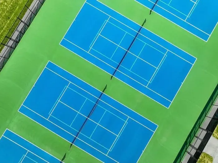 Framed Print : Aerial, drone, photo of new outdoor blue tennis court with white lines combined with light blue pickleball lines Framed Print : Aerial, drone, photo of new outdoor blue tennis court with white lines combined with light blue pickleball lines