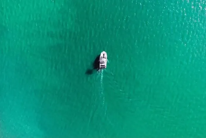 Framed Print : Aerial drone photo of rib speed boat cruising in tropical exotic bay with emerald sea Framed Print : Aerial drone photo of rib speed boat cruising in tropical exotic bay with emerald sea