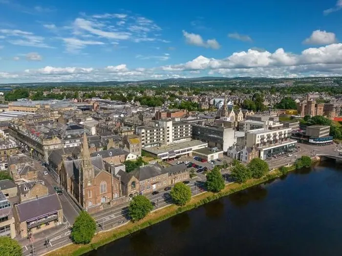 Framed Print : Aerial drone photo of the town centre and churches in Inverness next to the river Ness in Scotland Framed Print : Aerial drone photo of the town centre and churches in Inverness next to the river Ness in Scotland