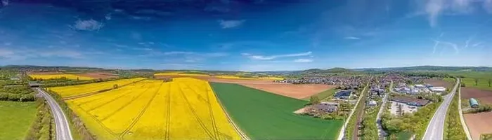 Framed Print : Aerial drone picture of rape field in spring in typical bright yellow color during daytime Framed Print : Aerial drone picture of rape field in spring in typical bright yellow color during daytime