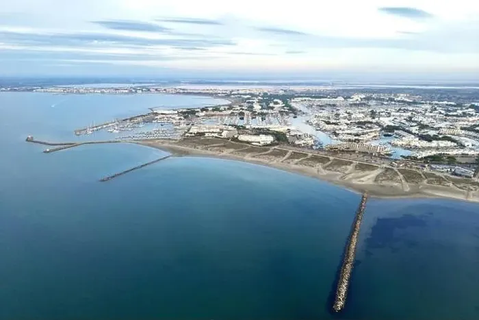 Framed Print : Aerial drone shot of the beach and piers of Port Camargue, Occitanie, France Framed Print : Aerial drone shot of the beach and piers of Port Camargue, Occitanie, France
