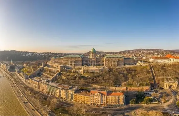 Framed Print : Aerial drone shot of Buda Castle palace facade on hill in Budapest sunrise glow Framed Print : Aerial drone shot of Buda Castle palace facade on hill in Budapest sunrise glow