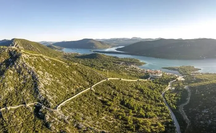 Framed Print : Aerial drone shot of City Wall of Ston over hill to Mali Ston in Croatia summer morning sunrise Framed Print : Aerial drone shot of City Wall of Ston over hill to Mali Ston in Croatia summer morning sunrise
