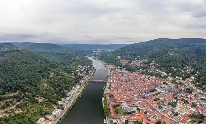 Framed Print : Aerial drone shot of Heidelberg old town in overcast at foot of Konigstuhl mountain Framed Print : Aerial drone shot of Heidelberg old town in overcast at foot of Konigstuhl mountain