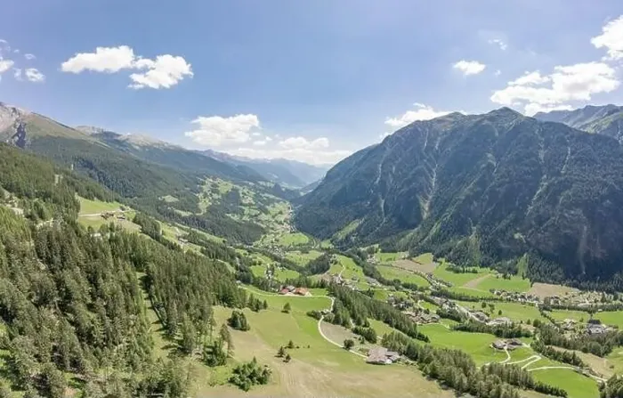 Framed Print : Aerial drone shot of Helligenblutt village in Grossglockner mountain valley in Austria Framed Print : Aerial drone shot of Helligenblutt village in Grossglockner mountain valley in Austria