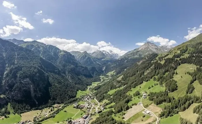 Framed Print : Aerial drone shot of Helligenblutt village in with view of Grossglockner mountain in Austria Framed Print : Aerial drone shot of Helligenblutt village in with view of Grossglockner mountain in Austria
