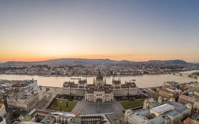 Framed Print : Aerial drone shot of Hungarian Parliament by Danube river in Kossuth Square in Budapest sunset Framed Print : Aerial drone shot of Hungarian Parliament by Danube river in Kossuth Square in Budapest sunset