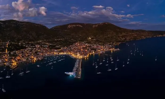 Framed Print : Aerial drone shot of Komiza town port in night with city light on Vis Island in Croatia summer dusk Framed Print : Aerial drone shot of Komiza town port in night with city light on Vis Island in Croatia summer dusk