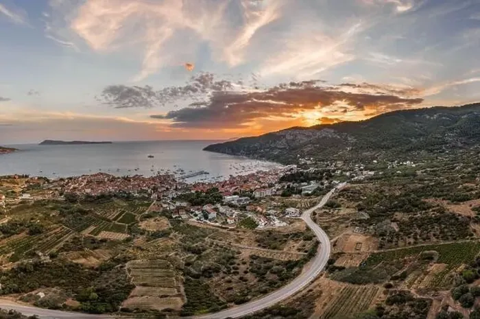 Framed Print : Aerial drone shot of Komiza town with sunset burning sky on Vis Island in Croatia summer Framed Print : Aerial drone shot of Komiza town with sunset burning sky on Vis Island in Croatia summer