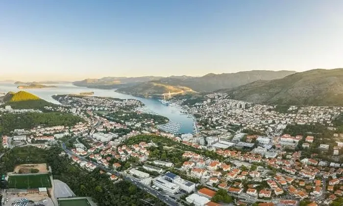 Framed Print : Aerial drone shot of Lapad Dubrovnik bridge with sunrise over peak in Croatia summer morning Framed Print : Aerial drone shot of Lapad Dubrovnik bridge with sunrise over peak in Croatia summer morning
