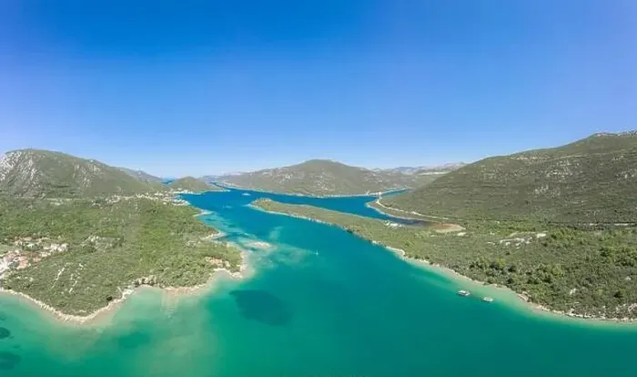 Framed Print : Aerial drone shot of Mali Ston mountains by sea in Croatia summer morning Framed Print : Aerial drone shot of Mali Ston mountains by sea in Croatia summer morning