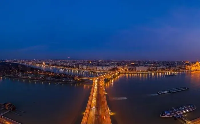 Framed Print : Aerial drone shot of Margaret Bridge with lights on over Danube river during Budapest sunset Framed Print : Aerial drone shot of Margaret Bridge with lights on over Danube river during Budapest sunset