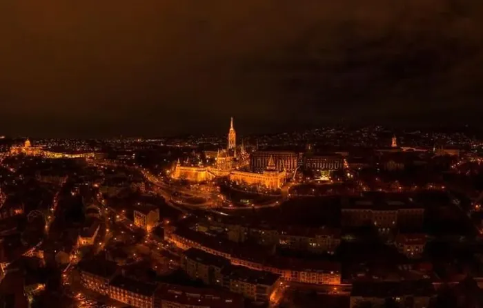 Framed Print : Aerial drone shot of Matthias Church with lights on Buda Hill in Budapest evening Framed Print : Aerial drone shot of Matthias Church with lights on Buda Hill in Budapest evening
