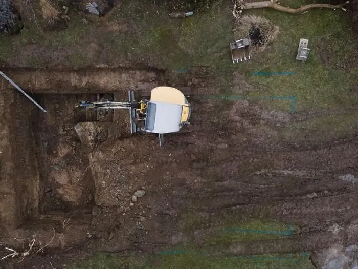Framed Print : aerial drone shot of small, yellow excavator stands in a large garden and digs a hole for a pool in austria Framed Print : aerial drone shot of small, yellow excavator stands in a large garden and digs a hole for a pool in austria