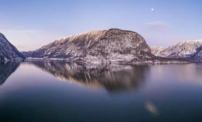Framed Print : Aerial drone shot of snow covered hill with reflection by Hallst