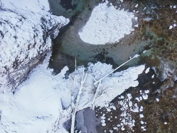Framed Print : Aerial drone shot of snowy and icy winter landscape in the oetschergraeben Framed Print : Aerial drone shot of snowy and icy winter landscape in the oetschergraeben