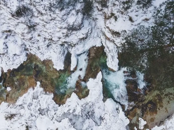 Framed Print : Aerial drone shot of snowy and icy winter landscape in the oetschergraeben Framed Print : Aerial drone shot of snowy and icy winter landscape in the oetschergraeben