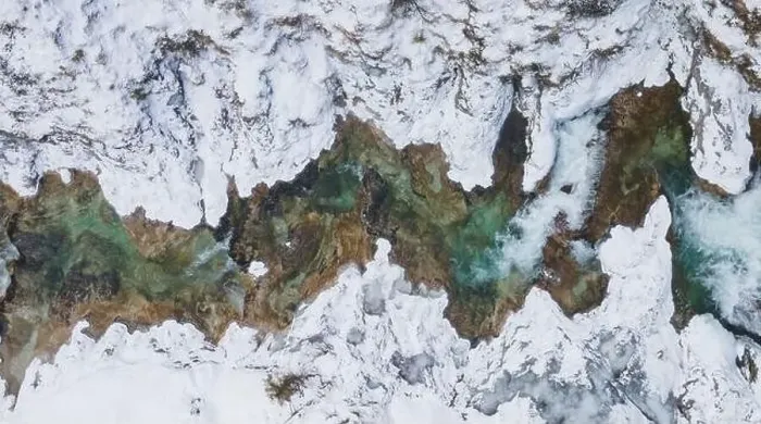 Framed Print : Aerial drone shot of snowy and icy winter landscape in the oetschergraeben Framed Print : Aerial drone shot of snowy and icy winter landscape in the oetschergraeben
