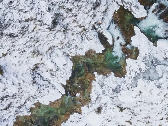 Framed Print : Aerial drone shot of snowy and icy winter landscape in the oetschergraeben Framed Print : Aerial drone shot of snowy and icy winter landscape in the oetschergraeben