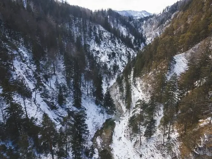Framed Print : Aerial drone shot of snowy and icy winter landscape in the oetschergraeben Framed Print : Aerial drone shot of snowy and icy winter landscape in the oetschergraeben