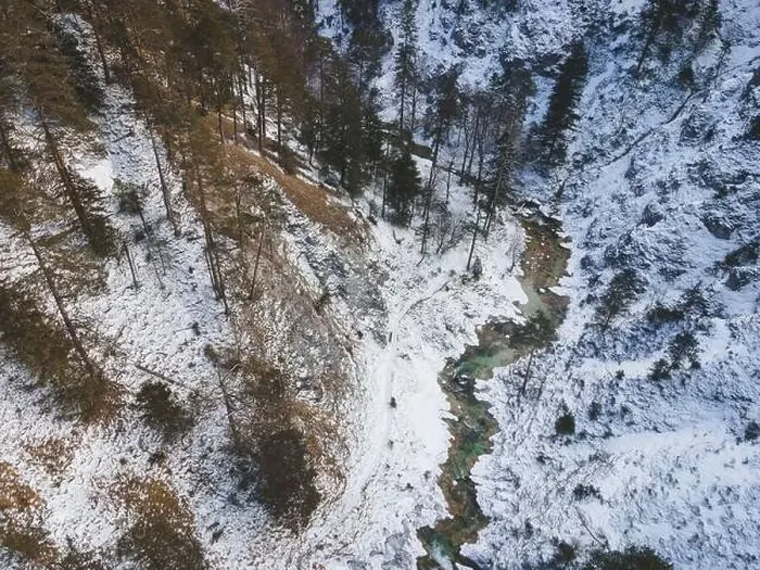 Framed Print : Aerial drone shot of snowy and icy winter landscape in the oetschergraeben Framed Print : Aerial drone shot of snowy and icy winter landscape in the oetschergraeben