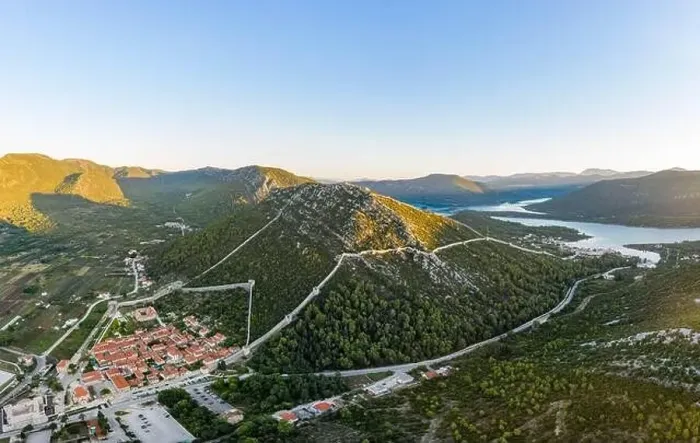 Framed Print : Aerial drone shot of Ston city wall over hill in Ragusa region near Dubrovnik in Croatia summer sunrise Framed Print : Aerial drone shot of Ston city wall over hill in Ragusa region near Dubrovnik in Croatia summer sunrise
