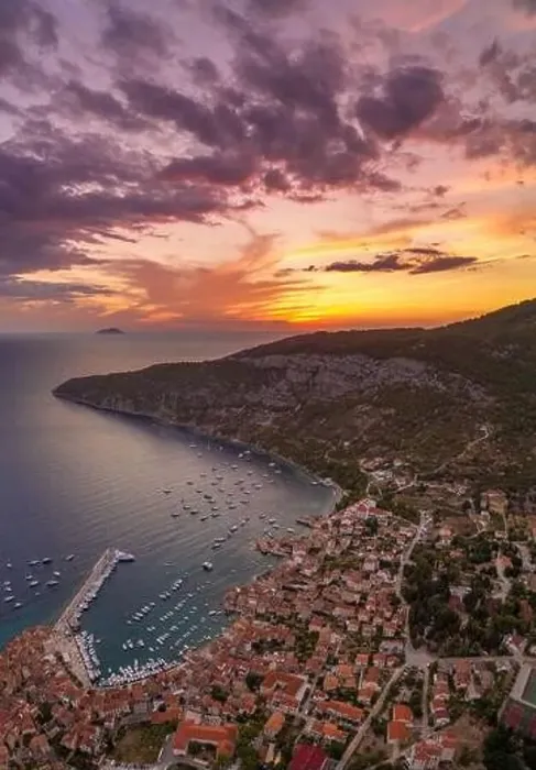 Framed Print : Aerial drone shot of sunset burning sky clouds on Komiza town over Vis Island in Croatia Summer Framed Print : Aerial drone shot of sunset burning sky clouds on Komiza town over Vis Island in Croatia Summer