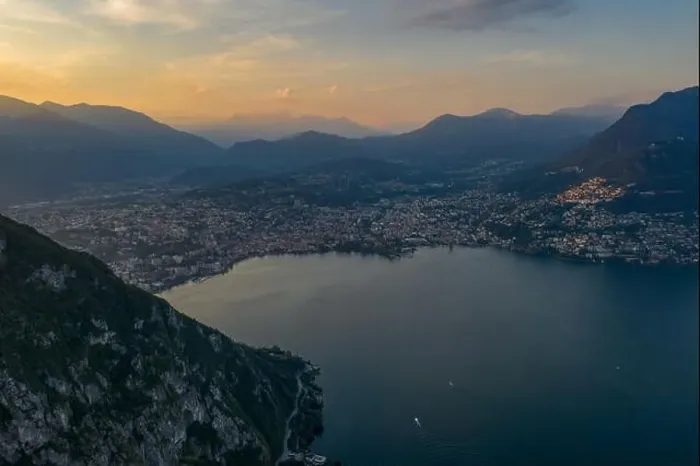Framed Print : Aerial drone shot sunset view of Lugano city by lake, Monte Bre and Mont Salvatore Framed Print : Aerial drone shot sunset view of Lugano city by lake, Monte Bre and Mont Salvatore