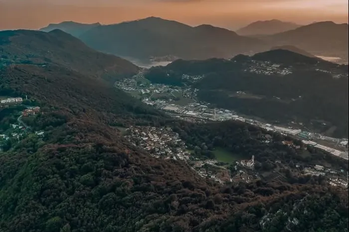 Framed Print : Aerial drone shot sunset view of Monte Salvatore, Swiss village Carabbia, Carabietta, agara Ti, Grancia Barbengo Framed Print : Aerial drone shot sunset view of Monte Salvatore, Swiss village Carabbia, Carabietta, agara Ti, Grancia Barbengo