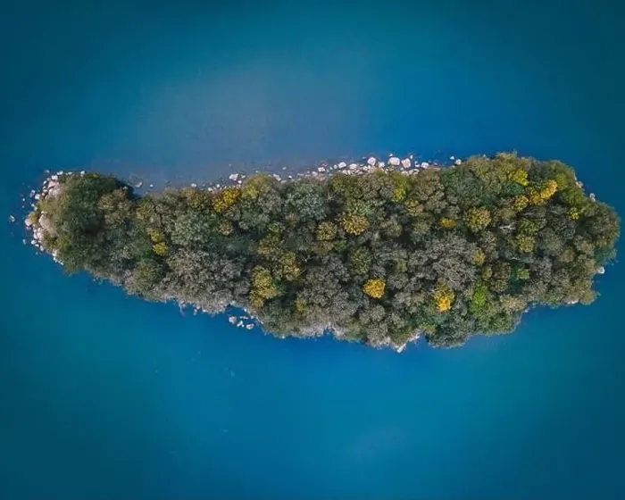 Framed Print : Aerial drone shot of tree covered island Framed Print : Aerial drone shot of tree covered island