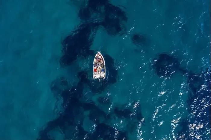 Framed Print : Aerial drone shot view of a boat in Ionian sea near Zakynthos Island Framed Print : Aerial drone shot view of a boat in Ionian sea near Zakynthos Island