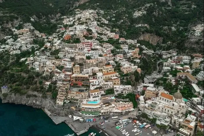 Framed Print : Aerial drone shot view of Positano village and beach in the morning in Amalfi Coast, Salerno Framed Print : Aerial drone shot view of Positano village and beach in the morning in Amalfi Coast, Salerno
