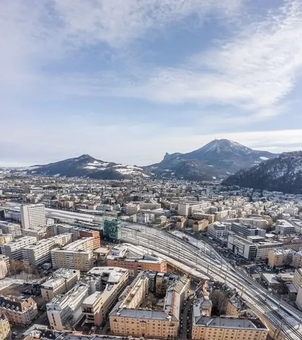 Framed Print : Aerial drone shot view of railway statioin in Salzburg covered with snow in winter morning Framed Print : Aerial drone shot view of railway statioin in Salzburg covered with snow in winter morning