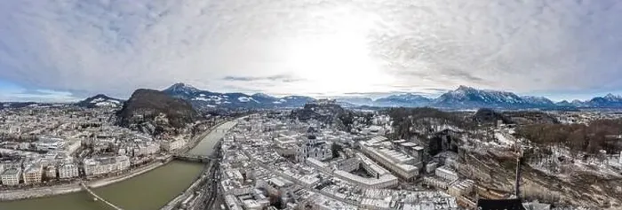 Framed Print : Aerial drone shot view of snowy salzburg city along river and mountain ridges in winter Framed Print : Aerial drone shot view of snowy salzburg city along river and mountain ridges in winter