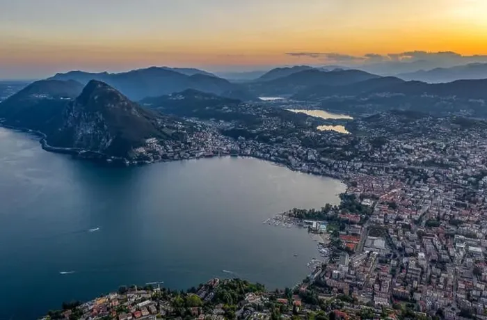 Framed Print : Aerial drone shot view before sunset of Swiss city Lugano and Monte Salvatore by Lago di lugano