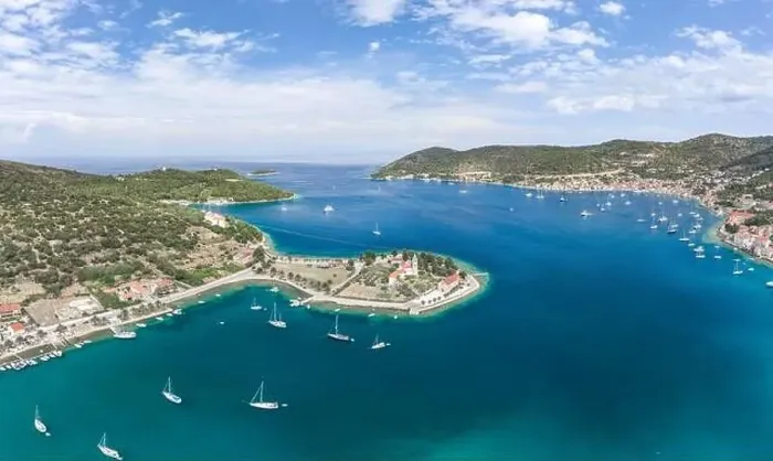 Framed Print : Aerial drone shot of Vis Island port with St. Jeronima church and Adriatic coastline in summer Framed Print : Aerial drone shot of Vis Island port with St. Jeronima church and Adriatic coastline in summer